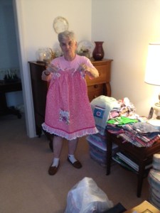 Janet Rolison showing one of the dresses she made that will be givien to a lucky child in Chiapas.